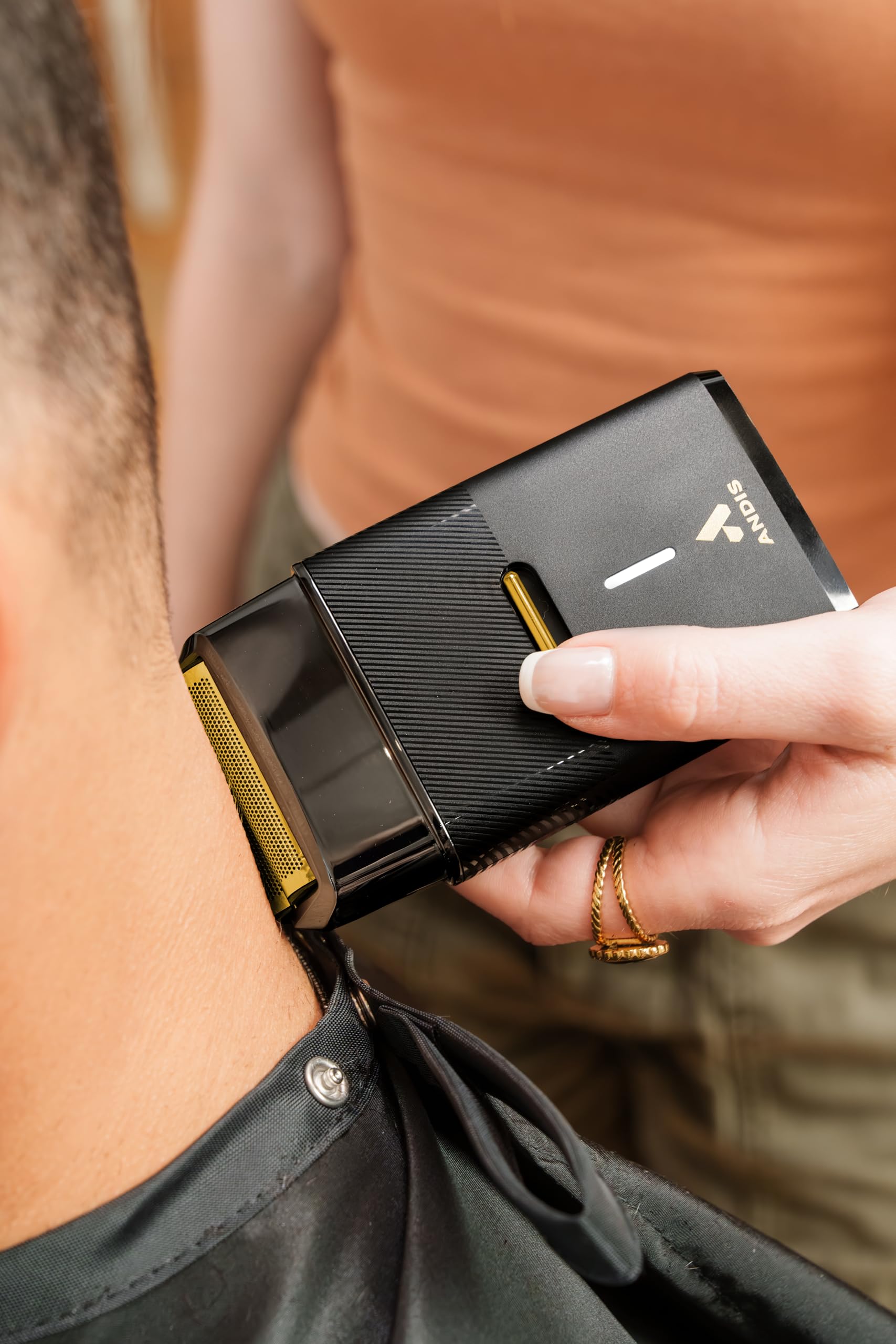 Light Salmon Andis 563616 Pro Foil Plus II Cordless Shaver, Gold Titanium Foils, Lithium Ion Battery, Includes USB-C Charging Stand, Black